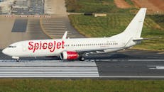 SpiceJet airplane taxiing on the runway at Dhaka Airport, Bangladesh.
